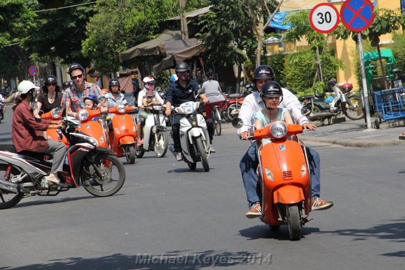 IMG_9889.JPG - Looks like a Rental motobike tour.  Check out the Dad and child on left having to navigate the no rules action . 