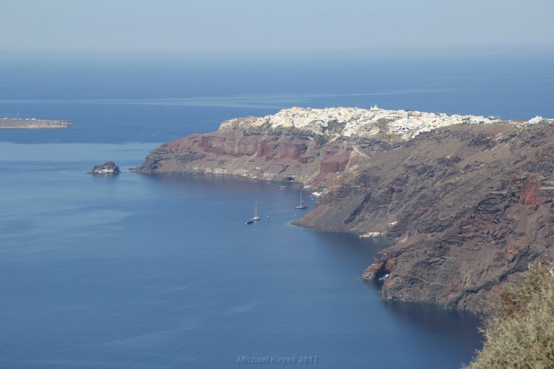 IMG_7392.JPG - Oia, with Amoudi bay, off in the distance. 